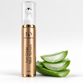 Eyeconic Glow Eye-Circle Mist Serum 15ml gold bottle beside fresh aloe vera slices