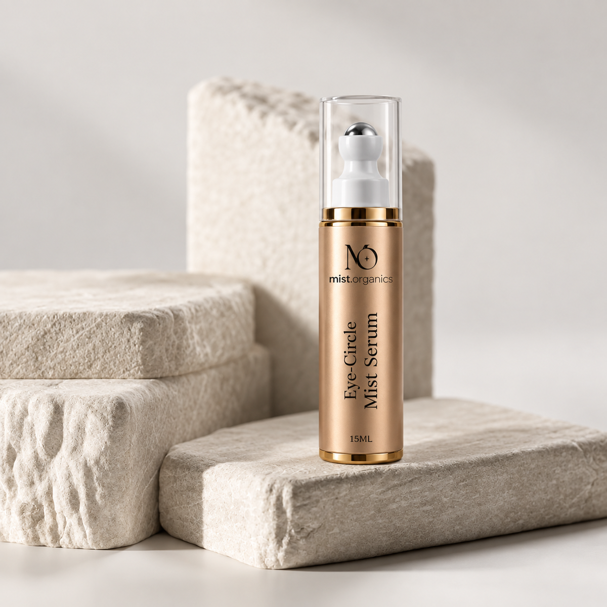 Eyeconic Glow Eye-Circle Mist Serum bottle styled on stone blocks