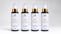 Four MistOrganics Hair Re-Grow Spray 100ml bottles lined up